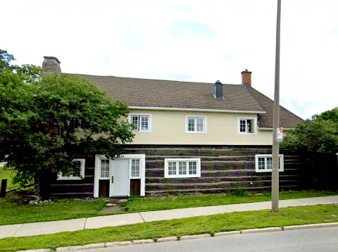 The Old Forge, a historic log building on Carling Avenue.